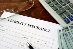 A pen rests on an empty liability insurance claim