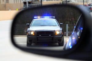 A Police Car Pulls over a Texas Driver after a traffic violation