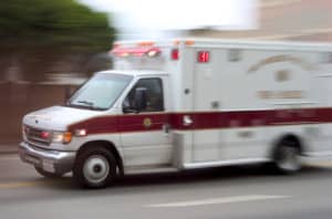 An ambulance speeds down the highway