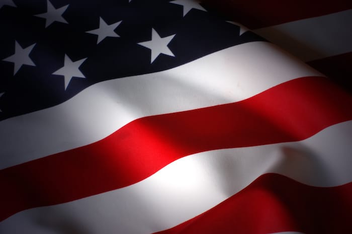 The american flag flies in the wind