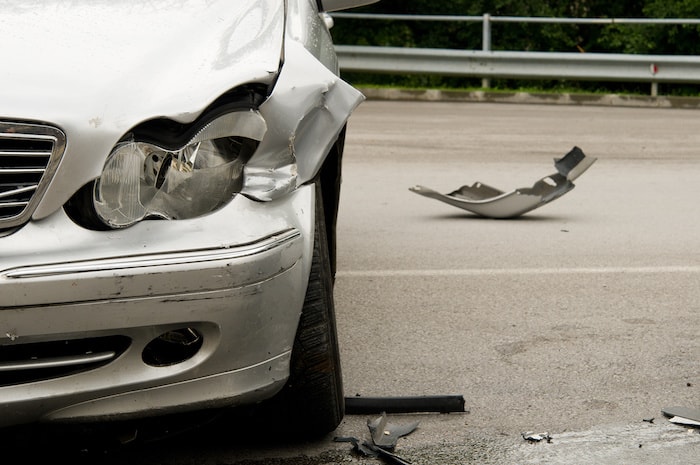 A luxury vehicle's damaged front end after a wreck
