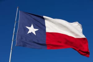 The State Flag of Texas flies in the wind