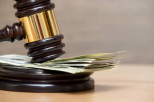 Law gavel on a stack of Dollar bills