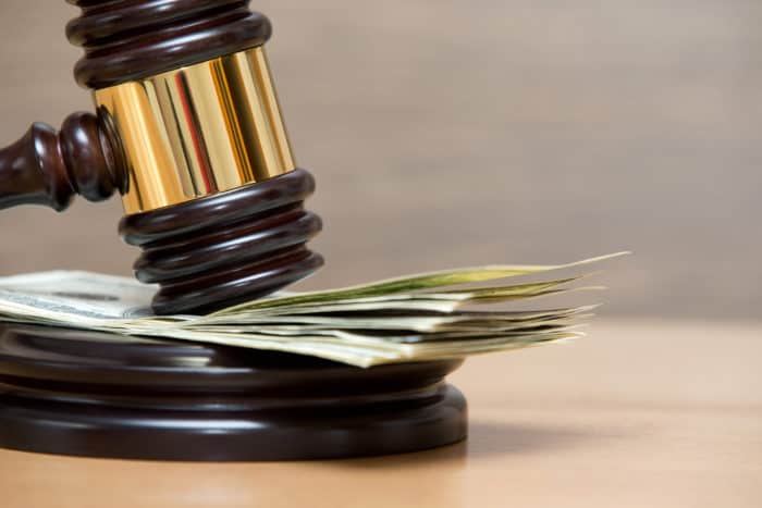 Law gavel on a stack of Dollar bills