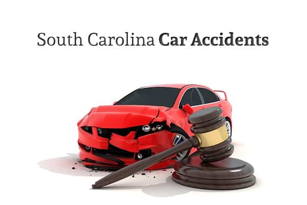 A red car that has been in a wreck sits behind a gavel, under the words "South Carolina Car Accidents"