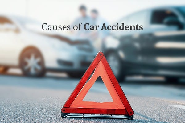 An orange caution triangle with a car wreck in the background and the words "Causes of Car Accidents"