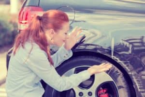 A lady in distress after a sideswipe from a hit and run accident. 