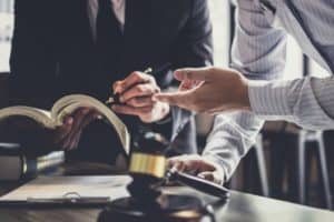 A lawyer discussing strategy with a client.