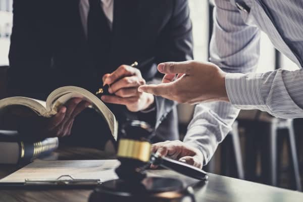 A lawyer discussing strategy with a client.