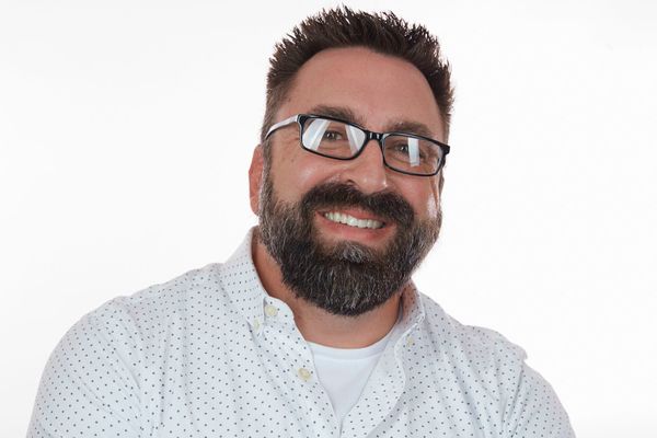 Professional headshot of claims manager Ricky Stephens