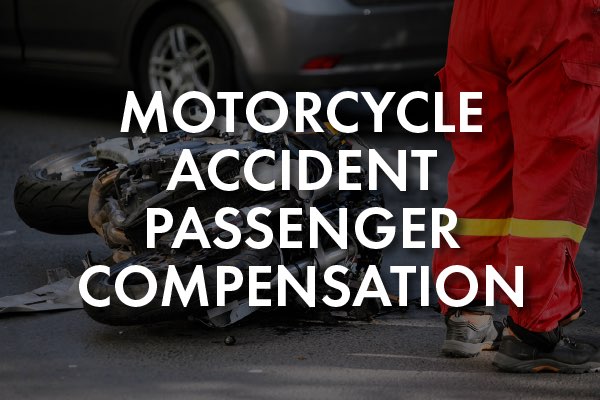 A motorcycle crash with the words, "motorcycle accident passenger compensation."