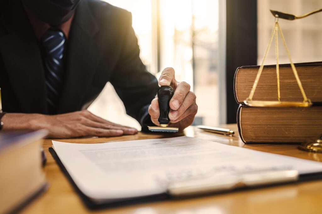 Lawyer stamping documents, symbolizing a consultation process with a personal injury attorney