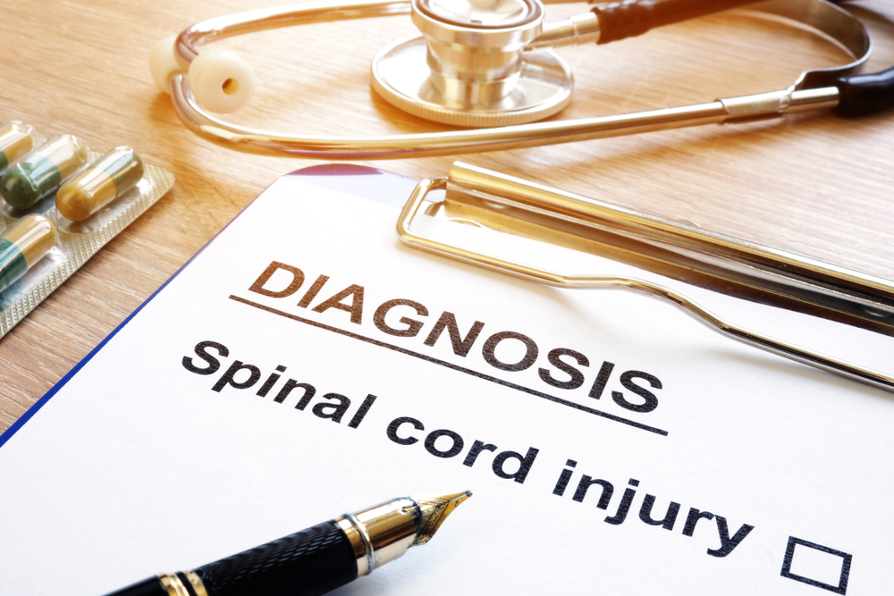 Diagnosis paperwork confirming a spinal cord injury, used as medical documentation in a lawsuit