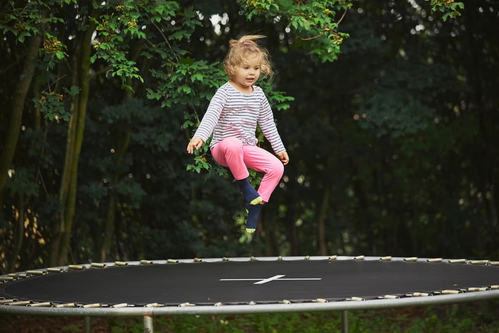 Child jumping on a trampoline