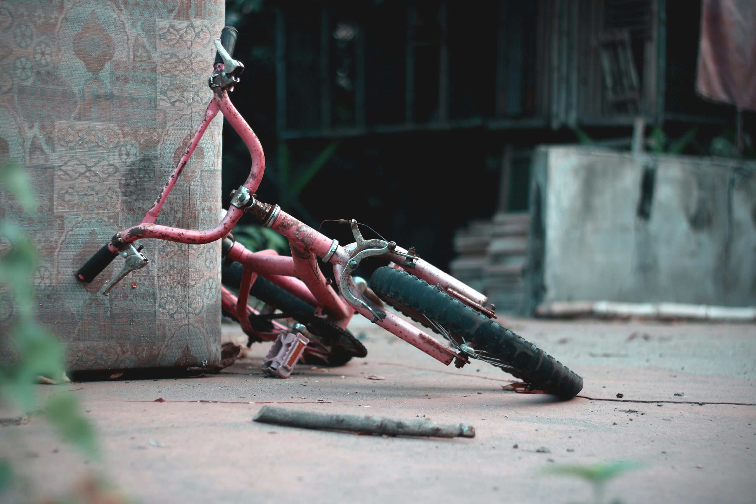 Damaged bicycle on the ground illustrating where bike accidents happen in Arlington residential areas.