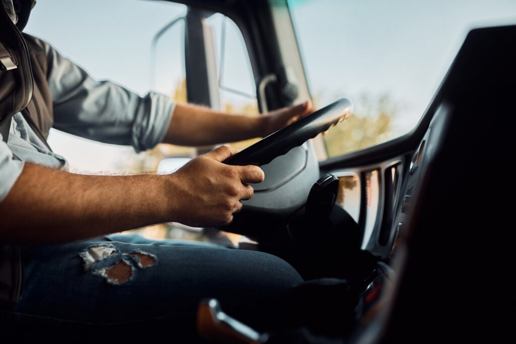 Interior view of a commercial truck cab in Texas, representing the investigation of driver behavior and preventable collisions.