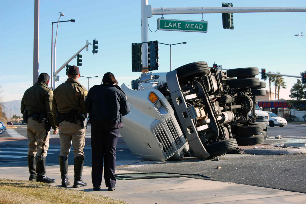 Emergency responders at the scene of an overturned semi-truck in a Texas intersection, representing critical filing deadlines.