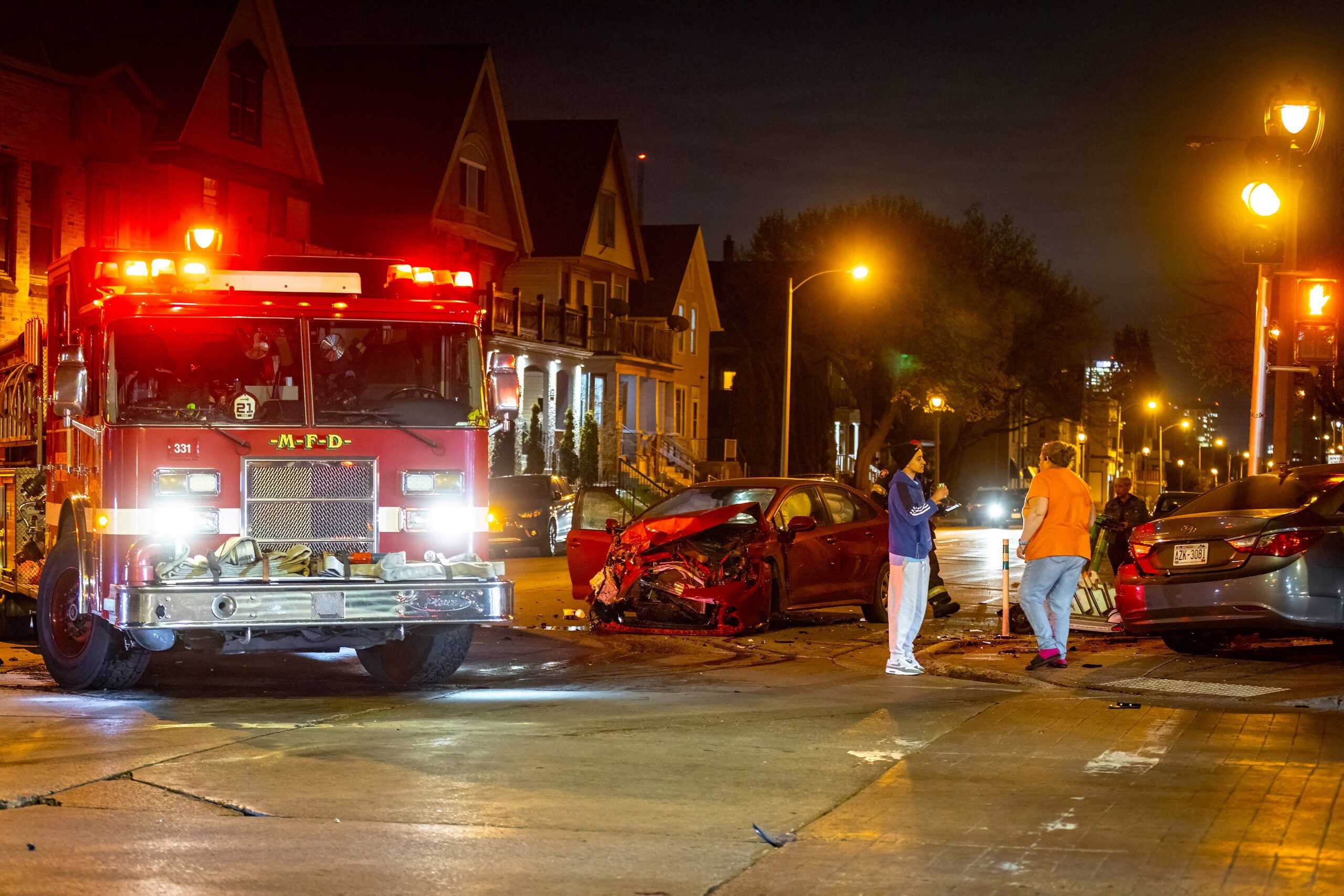 Emergency responders investigating one of several serious car accident scenarios in Arlington involving major vehicle damage and injured drivers at night