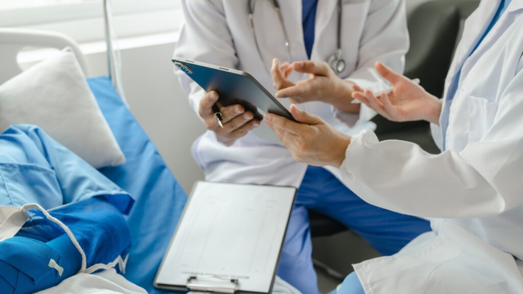 Medical professionals reviewing delayed injury symptoms after an Oklahoma City car accident claim