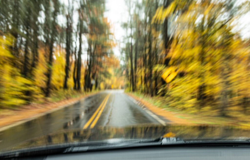 Blurred roadway view from inside a vehicle showing impaired driving effects linked to drug-impaired driving crashes and dangerous driving conditions in Texas