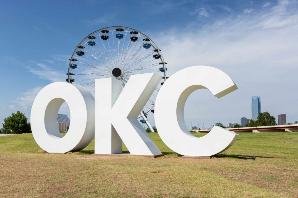 Large OKC sign and Ferris wheel, represented by Oklahoma City premises liability attorneys.