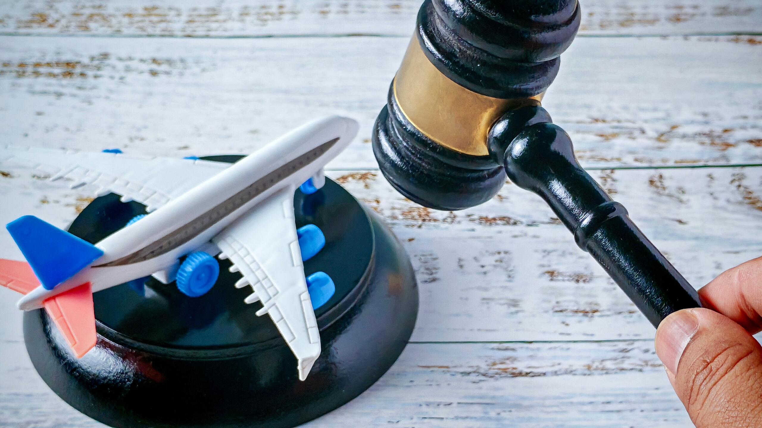 A judge gavel next to a model airplane symbolizes aviation litigation represented by Oklahoma City Airplane Accident Attorneys.