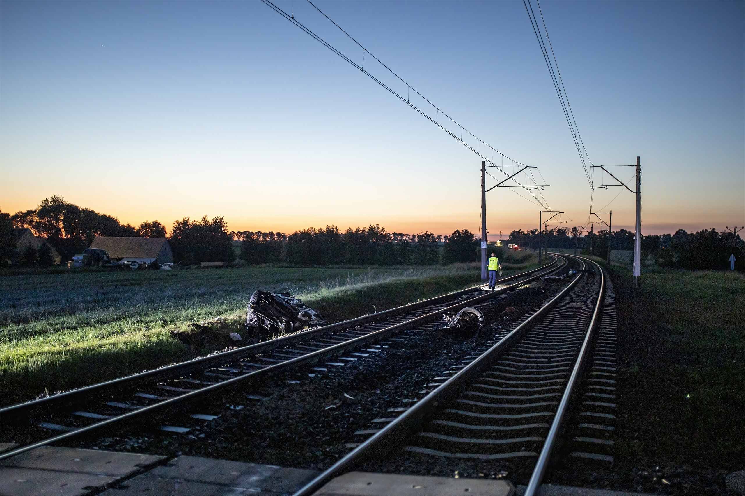 An investigator inspecting crash debris near train tracks represents cases handled by Oklahoma City Train Accident Attorneys.
