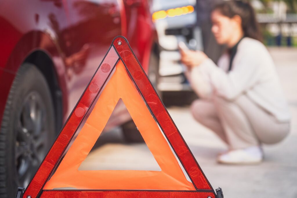 A safety triangle placed near a crashed vehicle helps document who is at fault for a T-Bone accident in Oklahoma City.